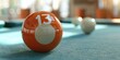 Close-up of an orange pool ball with the number thirteen. Suitable for sports and leisure concepts