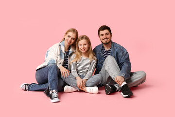 Poster - Happy family in stylish denim clothes sitting on pink background