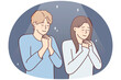 Positive man and woman praying asking god for happy marriage. Young couple stand with eyes closed and clasping palms in front of chest together performs religious ritual