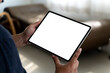 A businessman holds a mockup. digital tablet with blank screen Mockup Smart home control technology