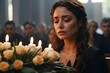 A sorrowful woman with closed eyes at a funeral, surrounded by candles and mourners