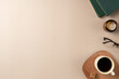 © Solesto - Book, glasses, candle, with cup coffee on beige background. Leisure concept, reading a book. Flat lay, top view