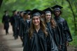 A group of graduates are walking down a path, smiling and wearing caps and gowns