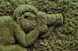 Relief carving of Monkey with camera in Monkey Forest. Ubud, Bali, Indonesia.
