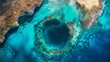 The panoramic aerial view reveals Dean's Blue Hole, linked to a lagoon and a stunning beach with turquoise waters, located on Long Island, Bahamas