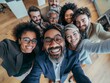 © Da - Multicultural happy corporate business successful people, the leader takes a group selfie with employees in the office, smiling happily at the camera, different people celebrating together, happy life