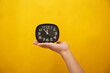 © Cuong - hand holding clock