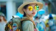 Young asian woman girl tourist holiday maker on the street exploring europian city wearing hat colorful sunglasses backpack with travel patches. Adventure travel tourism concept.