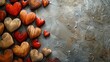   A collection of wooden hearts arranged on a metallic platform with chipped paint adorning the sides of the hearts