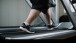 Legs of overweight man running on treadmill in gym with modern sports equipment. Desire to get rid of fat and mass in adulthood. Hard work to get perfect body and exercise for chubby people concept