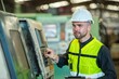 © BESTIMAGE - One man professional engineer worker technician checking old machine construction factory for maintenance. factory assistant worker in helmet check inspect old machinery construction in old factory.