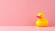 Classic Yellow Rubber Duck Toy on Soft Pink Background