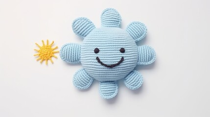 Knitted, cute sun with a smile on a white background, top view, with space for text. Greeting card, hobbies, knitting, children's toys.