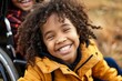 © Sach - Happy multiethnic family. Smiling little girl with disability in wheelchair, Generative AI