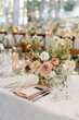 Chic wedding reception table with floral centerpiece