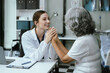 Female doctors shake hands with patients encouraging each other To offer love, concern, and encouragement while checking the patient's health. Concept Health care and Social Security