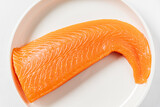 Fototapeta Kwiaty - salmon fillet on the white plate