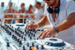 DJ hands mixing music on console mixer board at a luxury yacht party at sea in summer on vacation