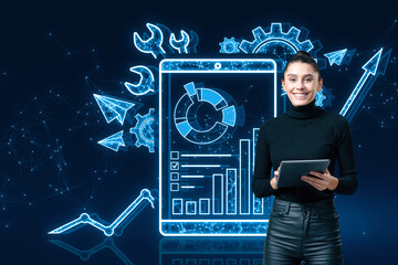 Wall Mural - Happy young woman with tablet and creative polygonal interface with cogs and business chart on blue background. Project management, maintenance tool and online finance system concept.