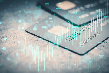 Poster - Close up of bank cards on desk with growing blue forex chart and map hologram on blurry background. Banking, invest and financial growth concept. Double exposure.