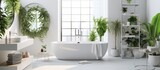 Fototapeta Las - In a serene bathroom, a white bathtub is surrounded by lush green plants creating a calming natural ambiance
