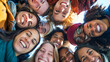 Overhead view of diverse friends forming a circle and smiling together
