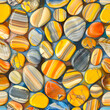Seamless pattern of yellow, orange and blue striped river stones.