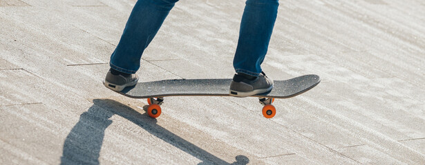 Wall Mural - Skateboard on asphalt road in city