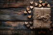 A rustic burlap gift box tied with twine and accompanied by scattered wooden heart cutouts professional photography