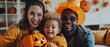 An ethnically diverse family celebrates Halloween at home with a mother, father, and young son