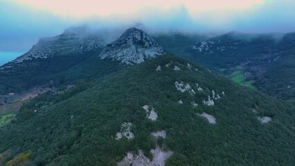 Wall Mural - Aerial view from a drone of Monte Candina and the town of Liendo. Liendo Valley in the Eastern Coastal Mountains. Cantabrian Sea. Autonomous community of Cantabria, Spain, Europe