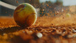 A green tennis ball on a clay court