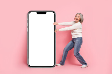 Sticker - Full length photo of lovely retired lady pull gadget device big smartphone wear trendy white garment isolated on pink color background