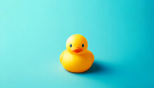 Bright Yellow Rubber Duck On A Turquoise Background, Minimalist Concept, Ideal For Bath Products Or Children's Goods Advertising.