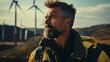 Man With Goatee by Wind Turbines