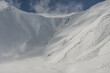Snow avalanche in the mountains. Aerial drone view of Gudauri ski resort in winter. Caucasus mountains in Georgia.  Kudebi, Bidara, Sadzele, Kobi aerial panorama in caucasus winter mountains.