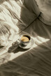 Cup of coffee in bed. Morning coffe time.
