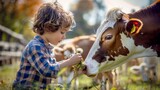 Fototapeta Kwiaty - cute little boy, caressing a cow