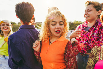 Happy young people dancing outdoor at festival event - Party, summer and entertainment concept - Focus on blonde girl face