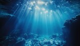Fototapeta  - Underwater rocks and sun rays. The concept of the underwater world and ocean depth.