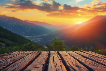 Wall Mural - A wooden table with a view of mountains and a sunset in the background