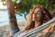 Serene Woman Relaxing in Hammock by the Beach at Sunset