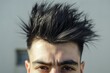 Close-up of a trendy and modern spiky hairstyle on a young adult man. Showcasing the creative and fashionable hairstyling with detailed texture and grooming