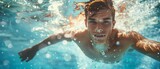 Fototapeta  - Swimming the front crawl in a pool, underwater