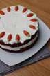 Homemade carrot cake with mascarpone cream cheese icing and mini marzipan carrot decorations