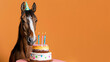 A horse wearing a birthday hat in front of a birthday cake isolated on orange background