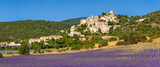 Fototapeta  - The Provence hilltop perched village of Simiane-la-Rotonde in summer with lavender filed. Alpes-de-Hautes-Provence, France