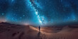 Lonely man standing in the vast desert with the milky way galaxy shining in the background at night