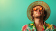 Portrait of handsome male in hawaii shirt and straw summer hat in banner solid background