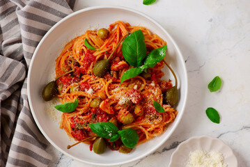 Wall Mural - Pasta Putaneska, with  tomato sauce  and basil .top veiw.selective focus